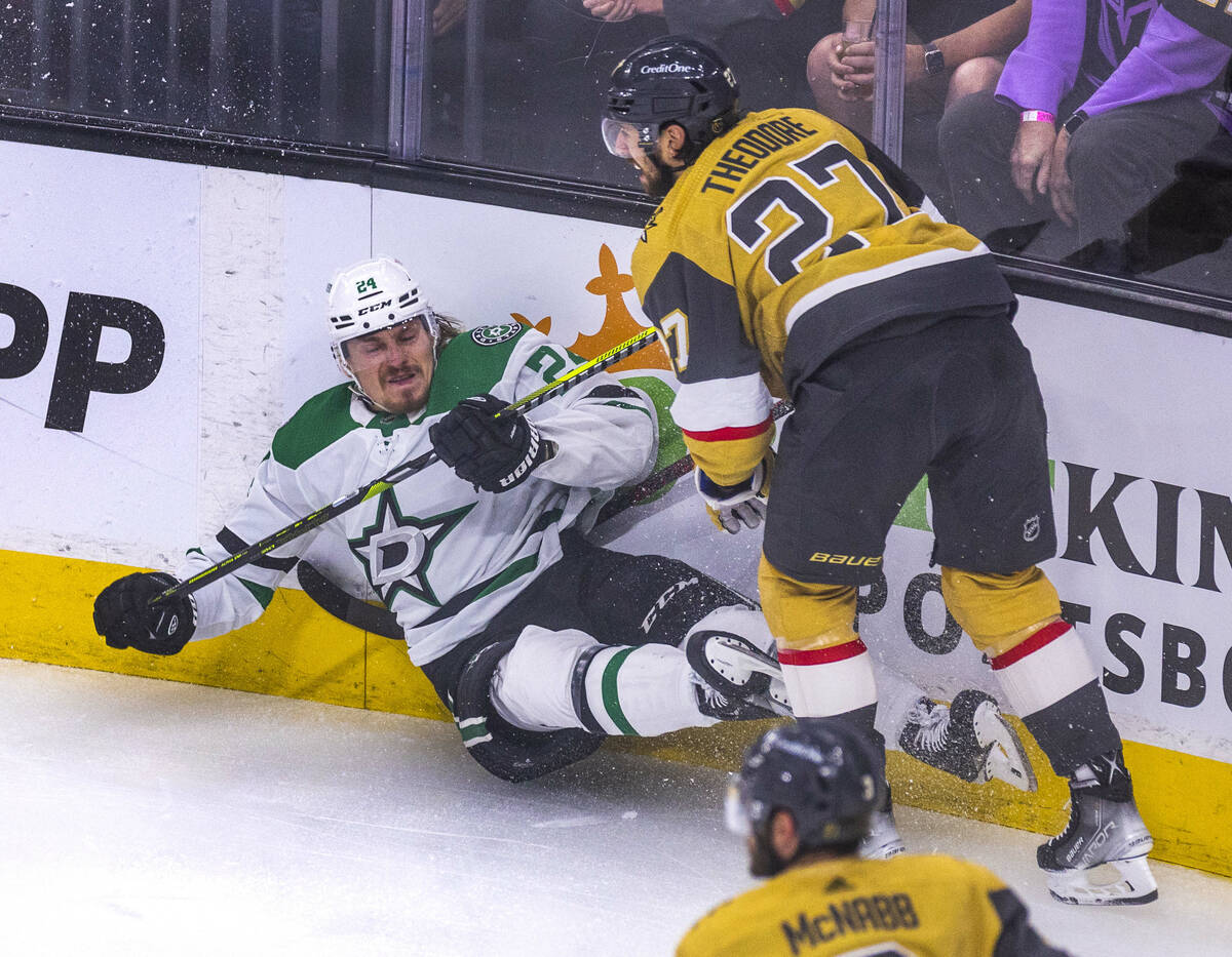 Dallas Stars center Roope Hintz (24) crashes into the boards after a shot by Golden Knights def ...