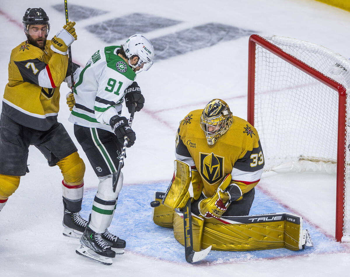 Golden Knights goaltender Adin Hill (33) rejects another shot attempt by Dallas Stars center Ty ...