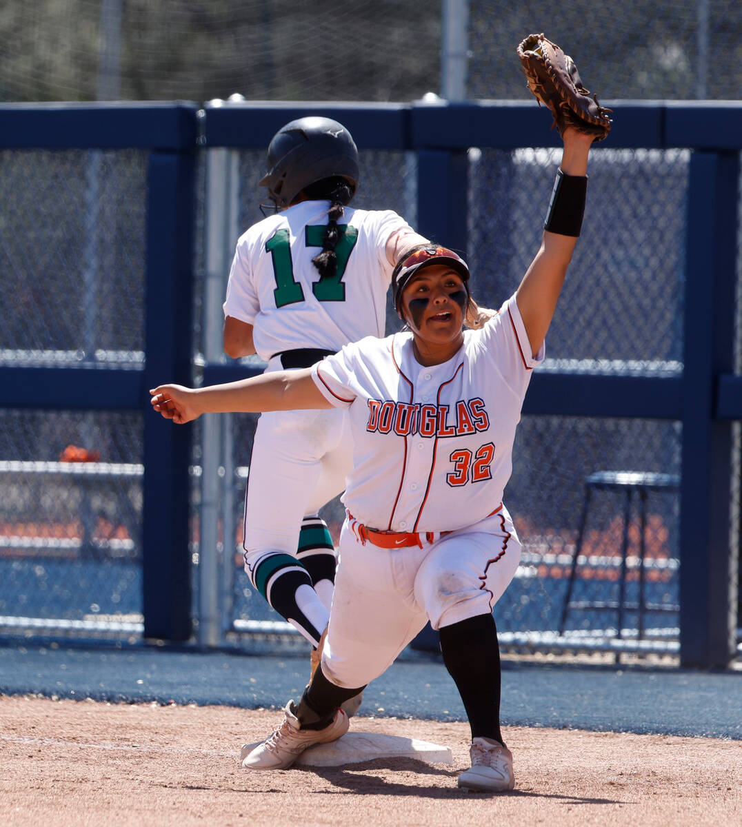 Palo Verde High's Makayla Enriquez (17) forced out by Douglas High's Bre Williams (32) during C ...