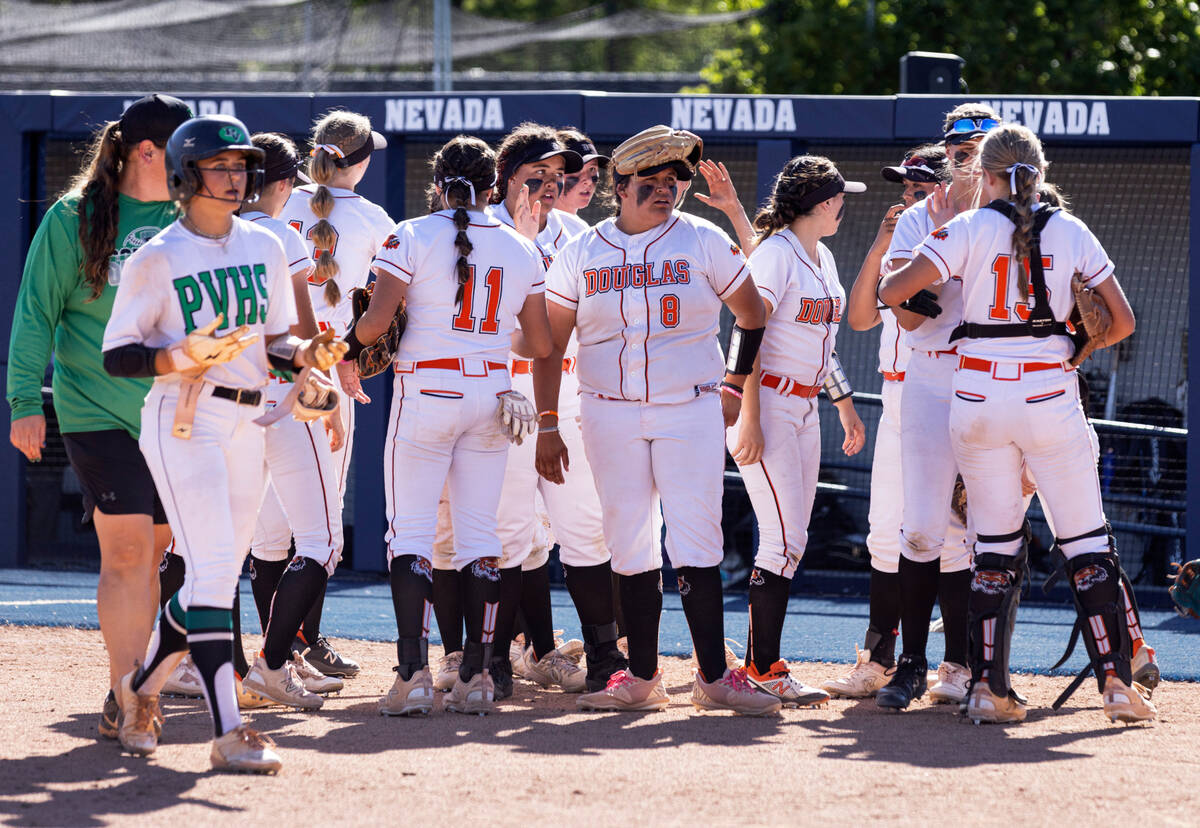Douglas High players celebrate their 8-3 win against Palo Verde High during Class 5A softball s ...