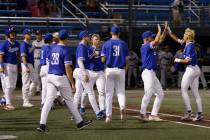 Bishop Gorman High School players congratulate each other after defeating Damonte Ranch High du ...