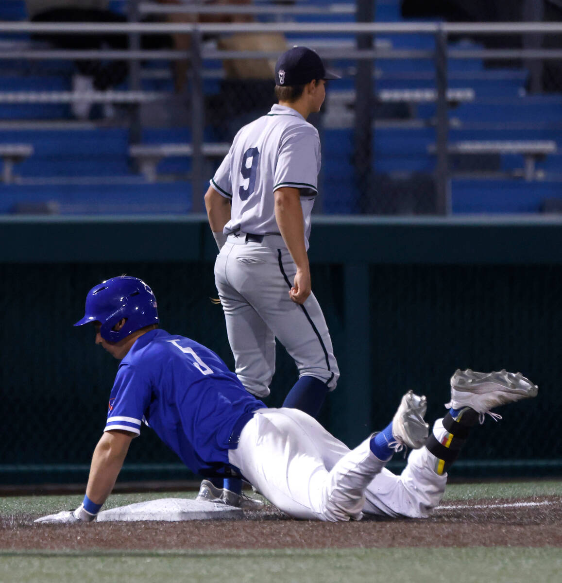 Bishop Gorman High's Burke Mabeus slides safe at third after hitting a triple against Damonte R ...