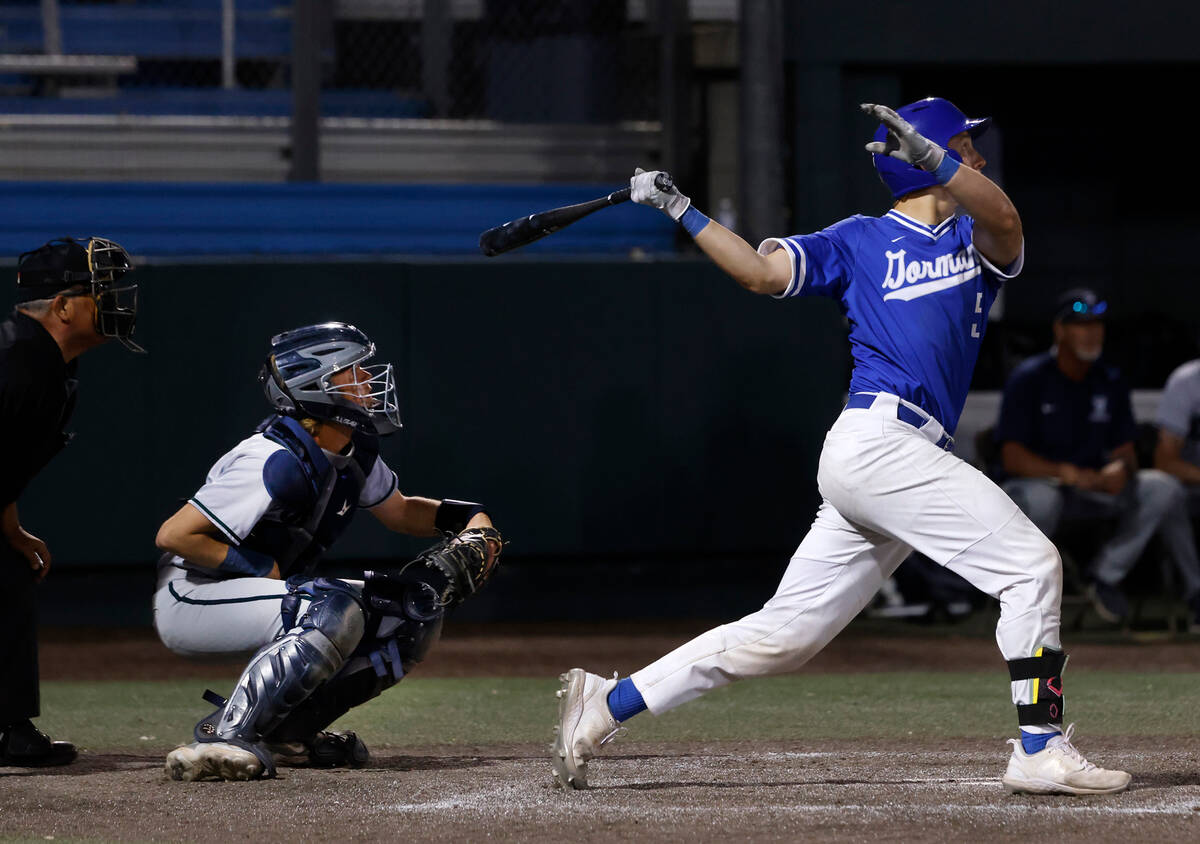 Bishop Gorman High's Burke Mabeus connects as he hits a triple against Damonte Ranch High durin ...