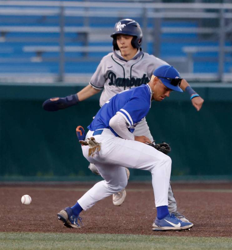 Damonte Ranch High's Ayden Grace (2) avoids a tag as Bishop Gorman High's Maddox Riske (2) drop ...