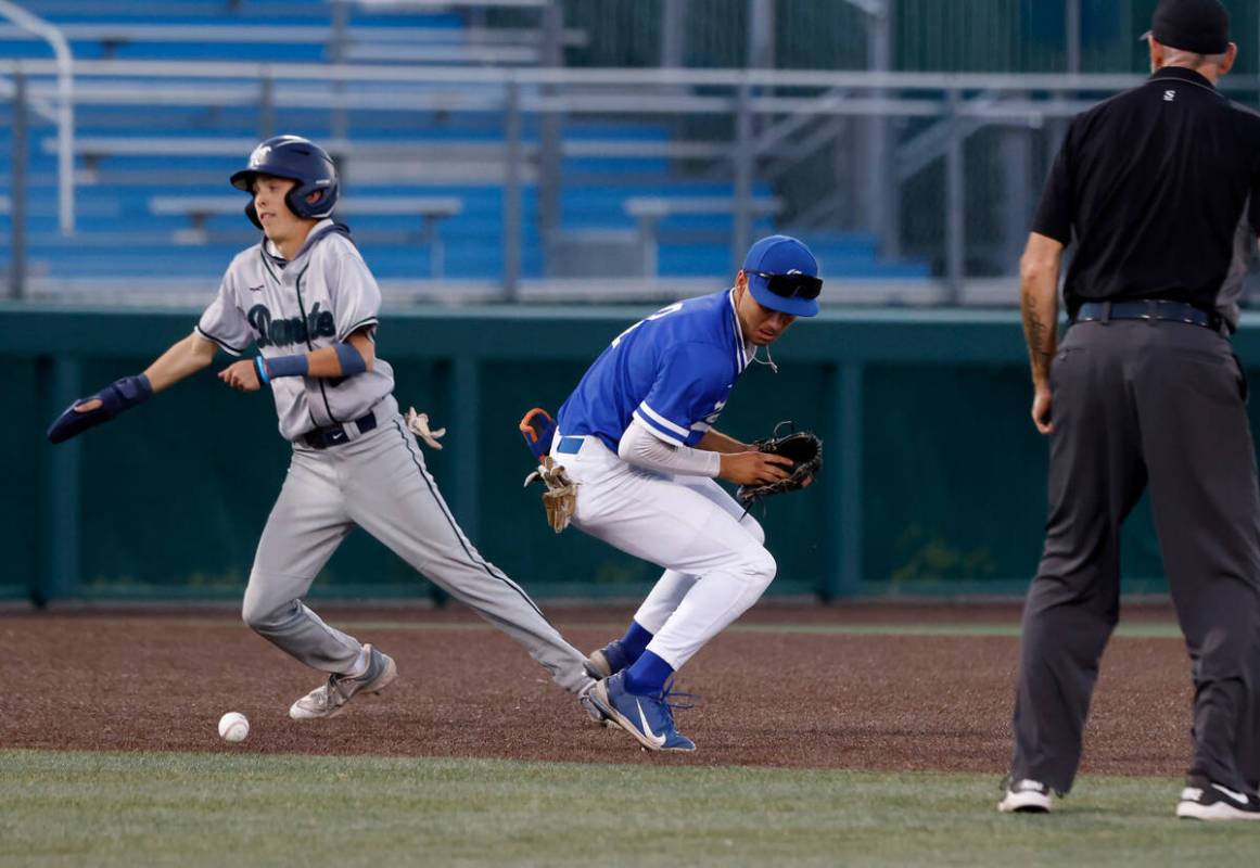 Damonte Ranch High's Ayden Grace (2) runs to third as Bishop Gorman High's Maddox Riske (2) dro ...