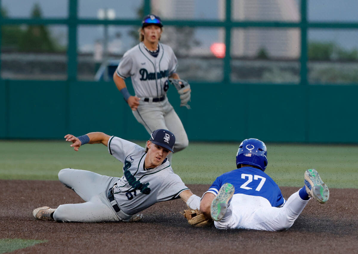 Bishop Gorman High's Nolan Eberwein (27) tagged out at second by Damonte Ranch High's Justin R ...