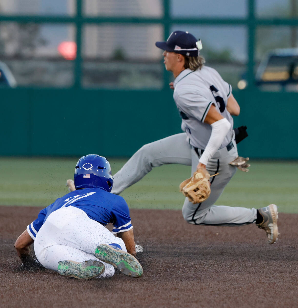 Bishop Gorman High's Nolan Eberwein (27) tagged out at second by Damonte Ranch High's Justin Ro ...