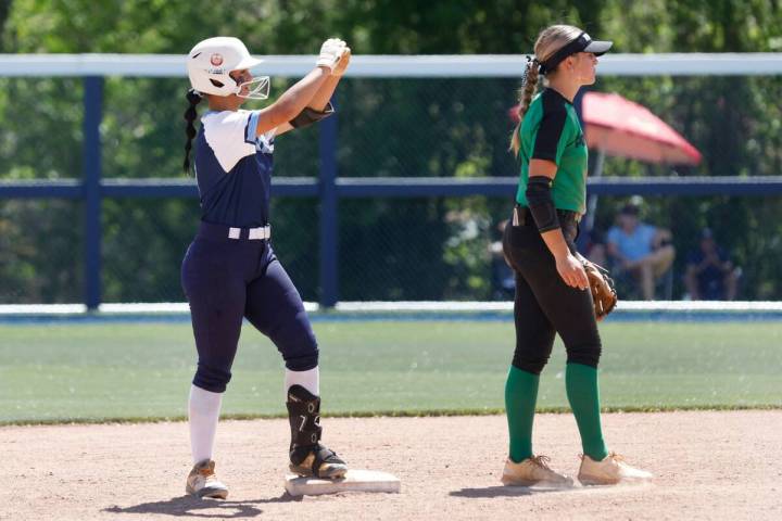 Centennial High's Amanda Campos-Colon (9) gestures toward her teammates after hitting a double ...