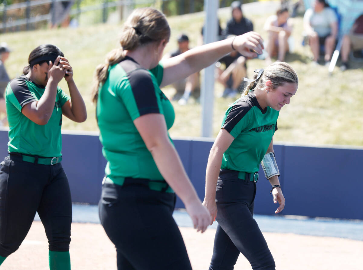 Palo Verde High players, including Cameron Lauretta, left, and Camryn Hunkins, right, get emoti ...
