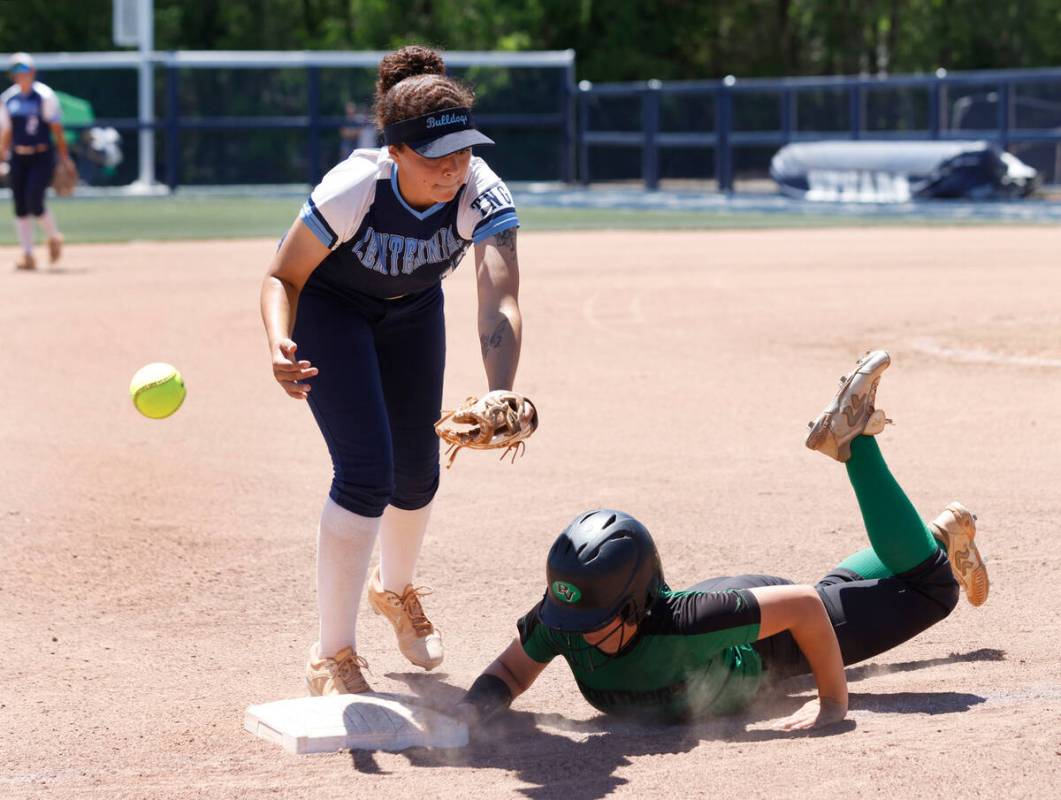 Palo Verde High's Belle Will slides safe at third as Centennial High's third baseman Keana Bell ...