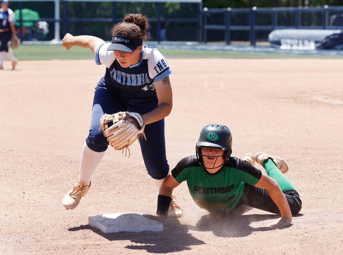 Palo Verde High's Belle Will slides safe at third as Centennial High's third baseman Keana Bell ...