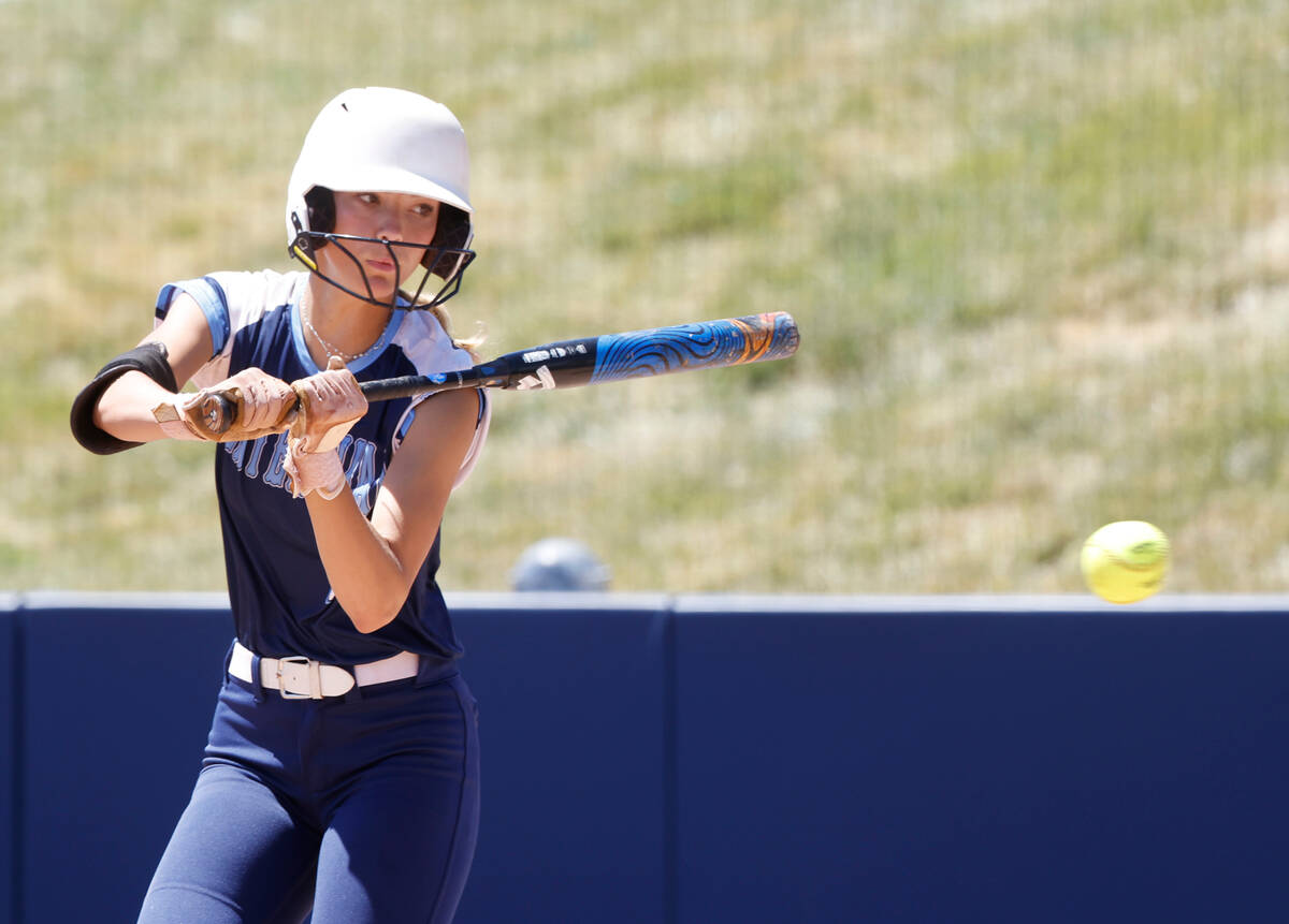 Centennial High's outfielder Jill Halas looks at the passing ball as she attempts to bunt again ...