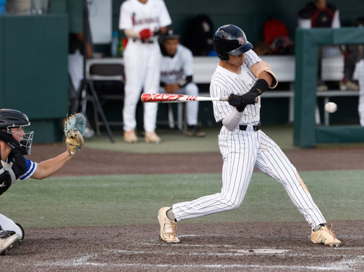 Desert Oasis High's Noah Griffith connects for a hit against Bishop Gorman during Class 5A stat ...