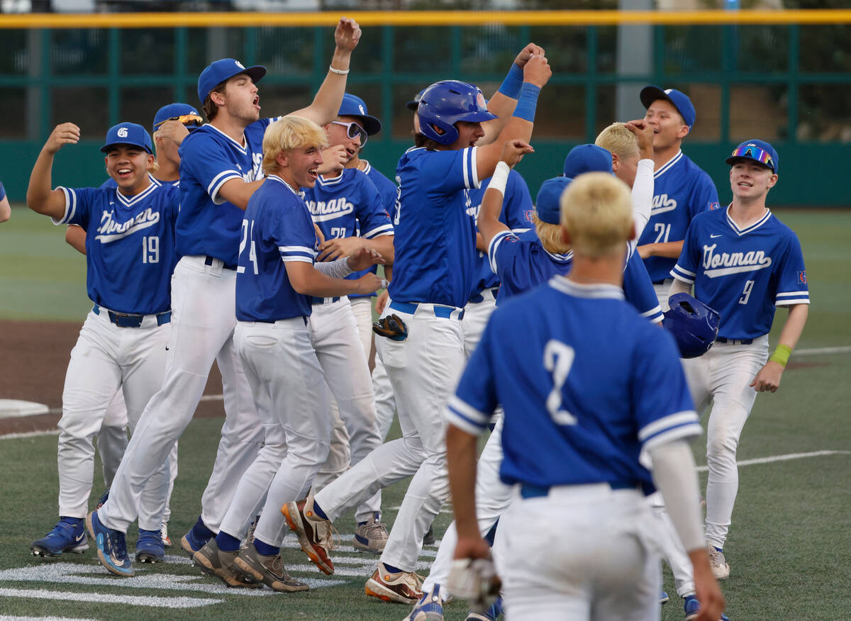 Bisho Gorman High School players celebrate as they advance to Class 5A state high school baseba ...