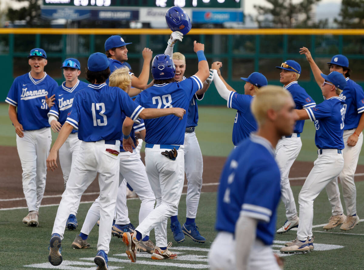 Bisho Gorman High School players celebrate as they advance to Class 5A state high school baseba ...