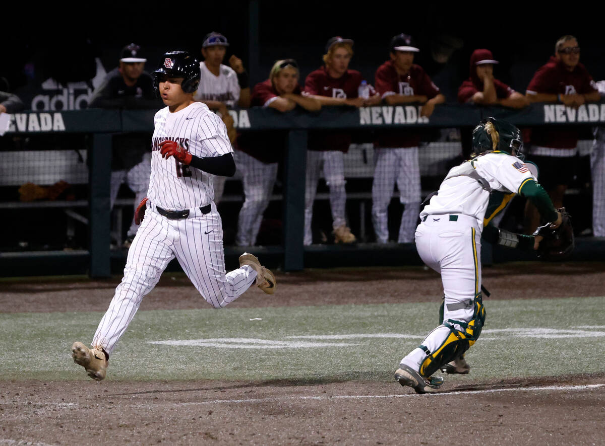Desert Oasis High's Seth Lyons scores against Bishop Manogue High during Class 5A state high sc ...