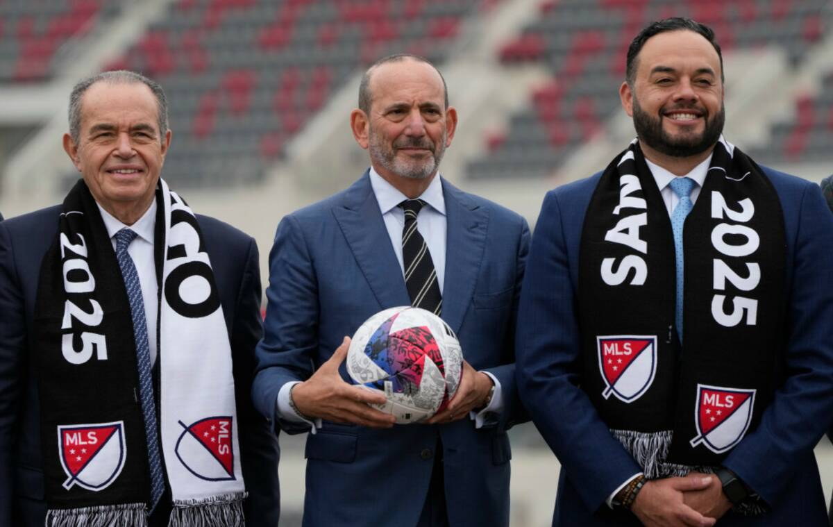 Sycuan Tribe Chairman Cody Martinez, right, stands alongside MLS Commissioner Don Garber, cente ...