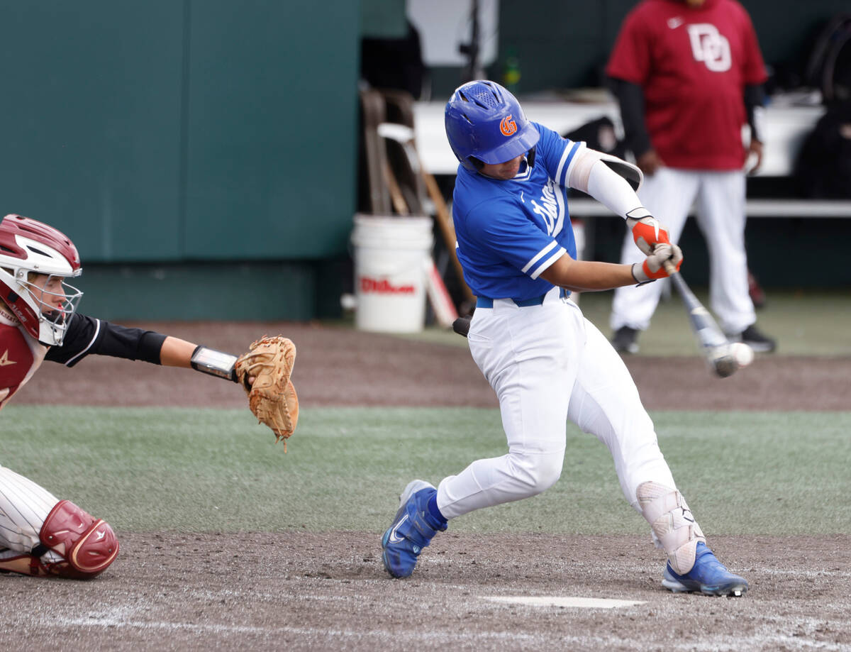 Bishop Gorman's Marcus Matias connects for a hit against Desert Oasis during a Class 5A high sc ...