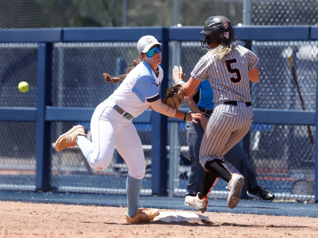 Centennial's infielder Carmella Korte missed the ball and unable to tag out Douglas' Ava Delane ...