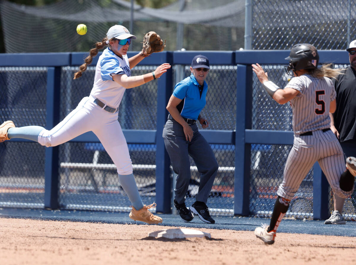 Centennial's infielder Carmella Korte missed the ball and unable to tag out Douglas' Ava Delane ...