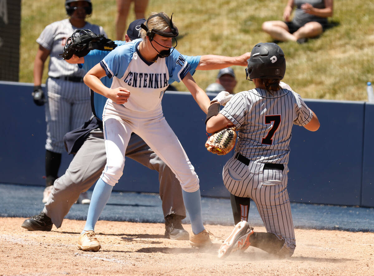 Douglas' Mercedes Covey (7) slides and scores at home as Centennial's Teagan Clemmons tries to ...
