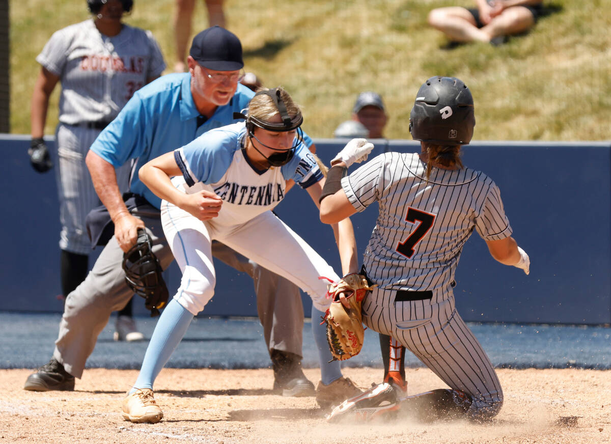 Douglas' Mercedes Covey (7) slides and scores at home as Centennial's Teagan Clemmons tries to ...