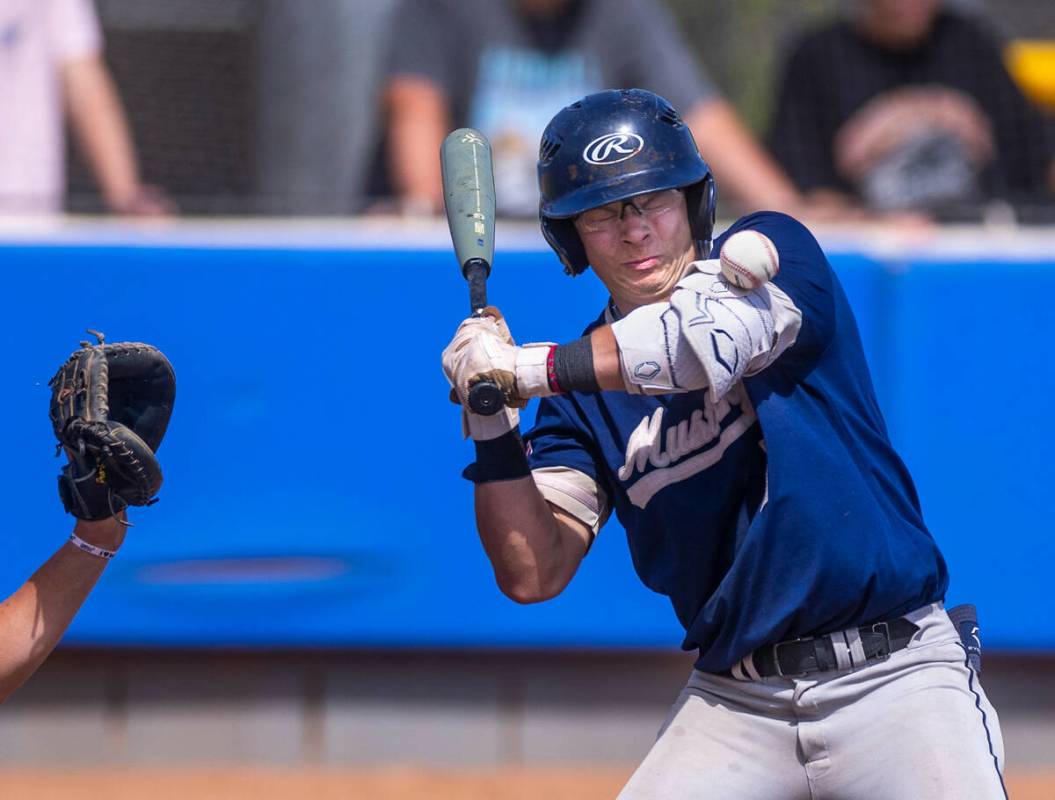 Shadow Ridge batter Evan Harnum gets hit by a Foothill pitch during the first inning of a NIAA ...