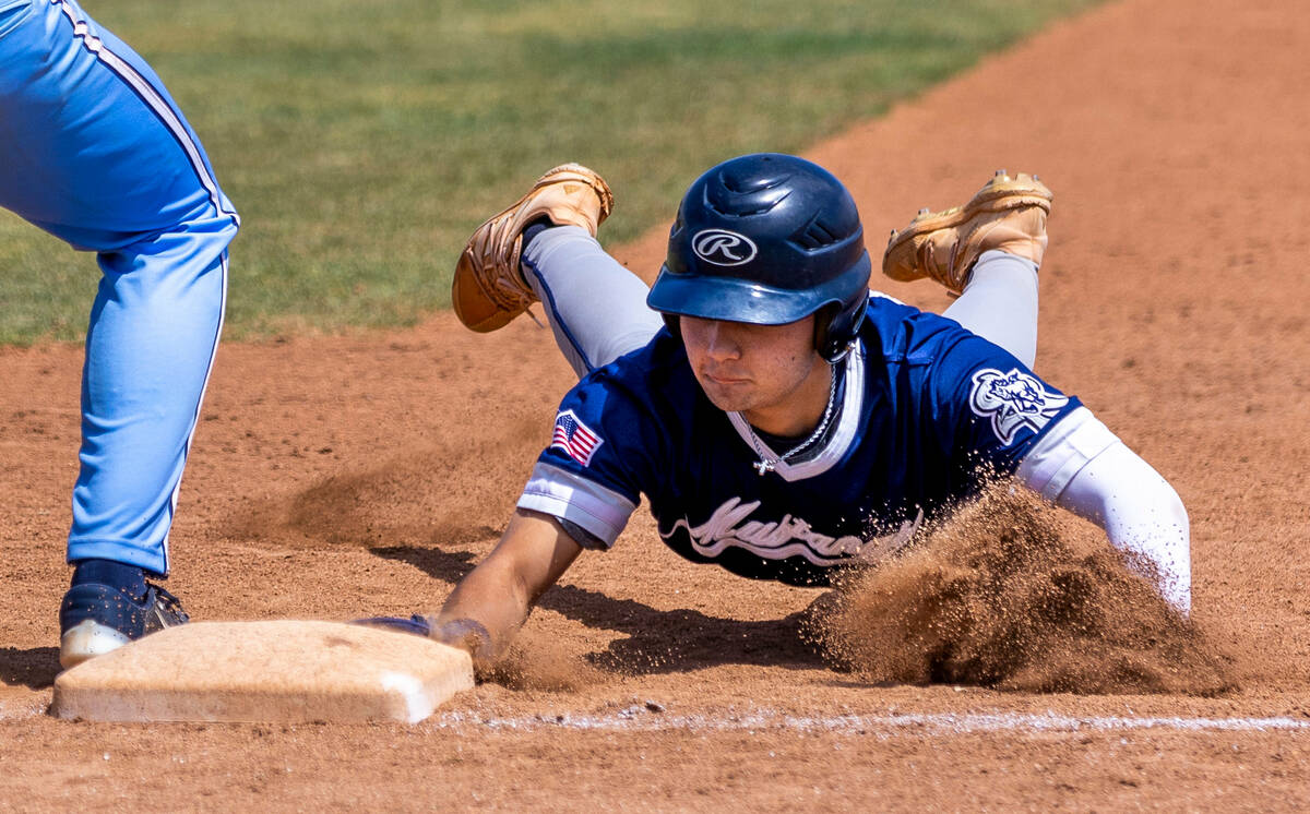 Shadow Ridge runner Paul Wescott dives safelty back to first base against Foothill during the f ...
