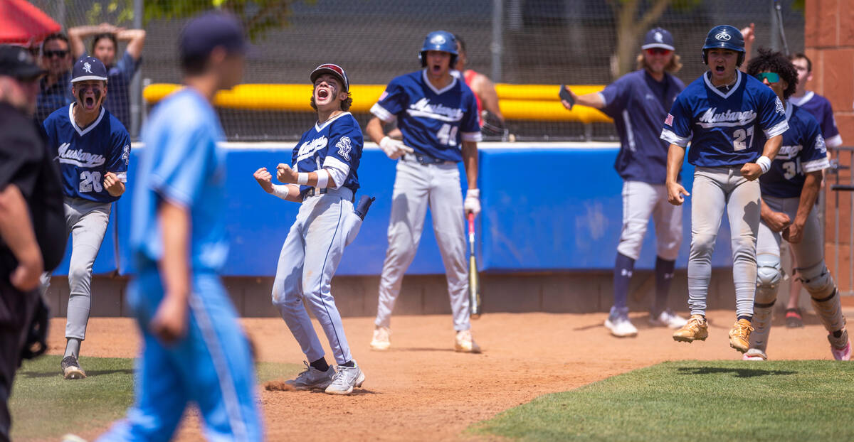 Shadow Ridge players celebrate several runs against Foothill during the sixth inning of a NIAA ...