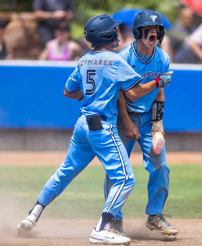 Foothill batters Matt Szymarek and Landon Angelo celebrate a go-ahead run against Shadow Ridge ...