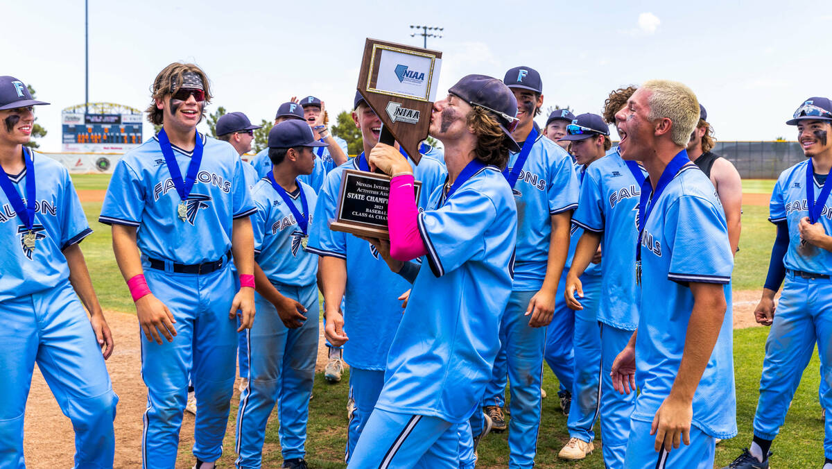 Foothill players take turns kissing the trophy as they celebrate their win over Shadow Ridge 3- ...