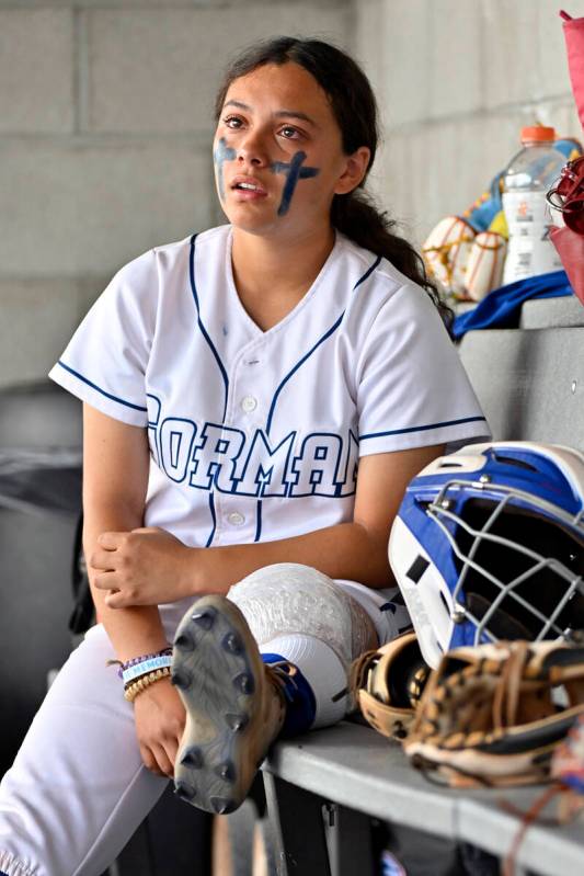 Bishop Gorman’s Sarah Fonseca is teary eye as her leg is iced in the dugout during the 4 ...