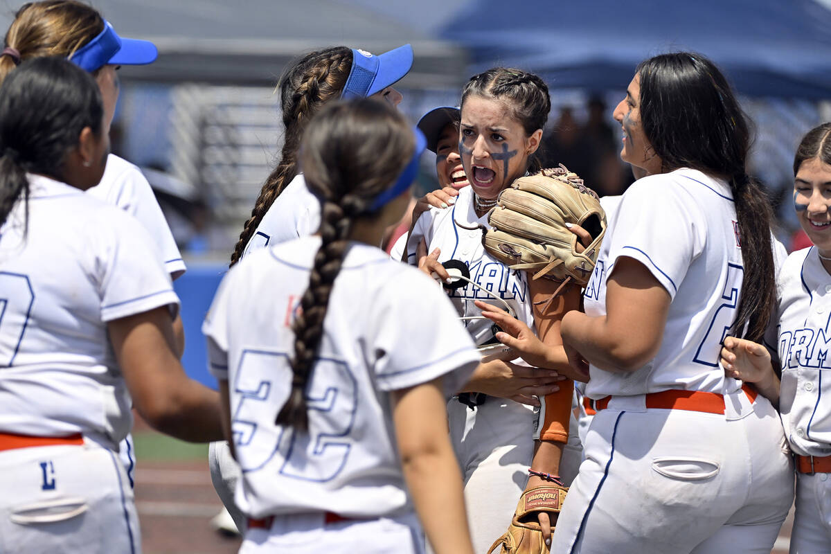 Bishop Gorman pitcher Gianna Hornyak, center, is congratulated by teammates after the end of an ...