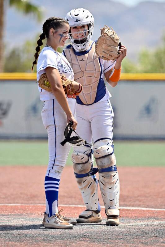 Bishop Gorman pitcher Gianna Hornyak, left, confers with catcher Chloe Makinney during a break ...