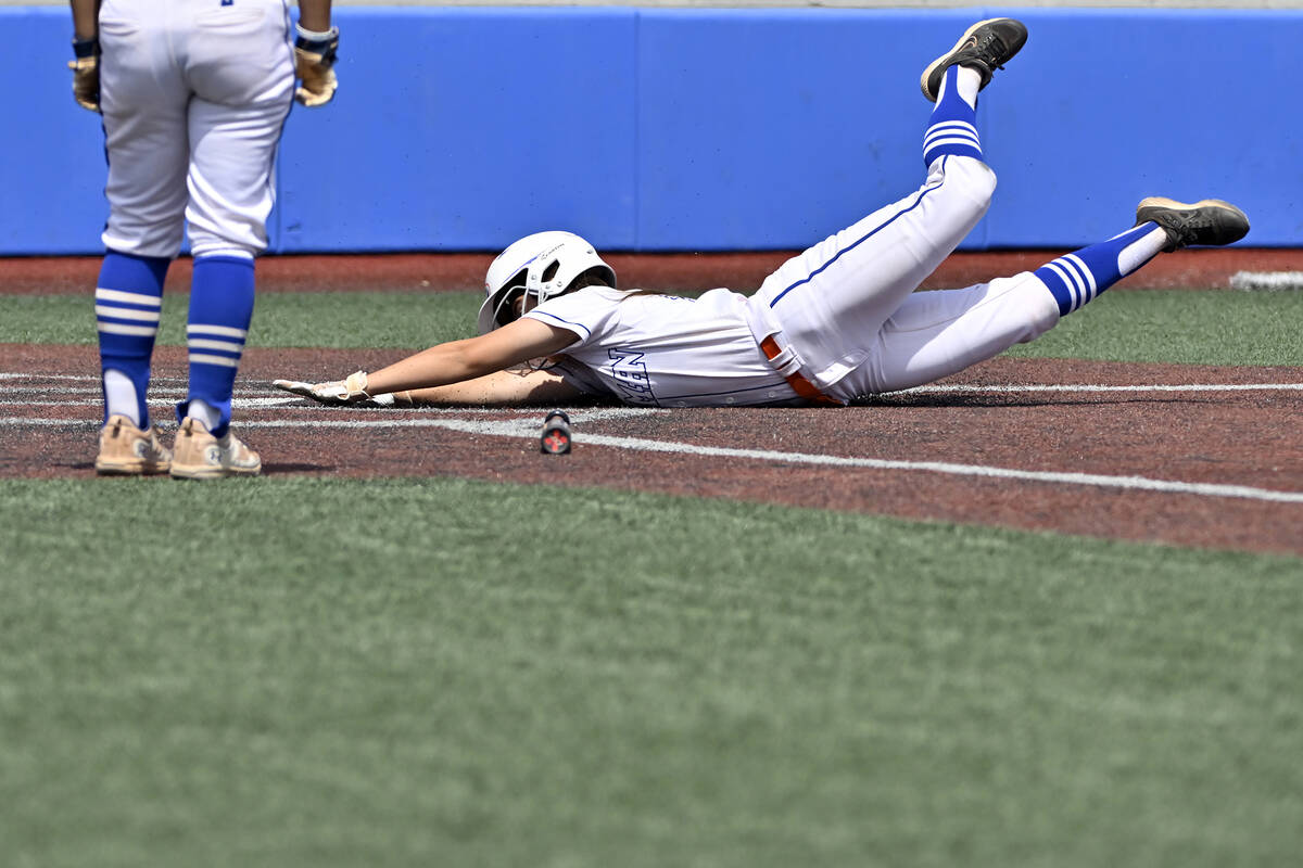 Bishop Gorman’s Raelynne Brown slides safely home during the first inning against Silver ...