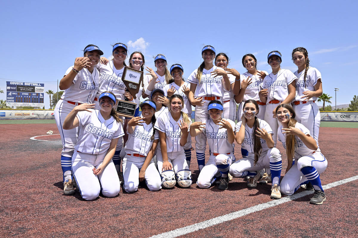 Bishop Gorman poses with the championship trophy after defeating Silverado 12-7, in the 4A stat ...