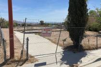 A fence lines an uneven foundation where a home once stood in the Windsor Park neighborhood of ...