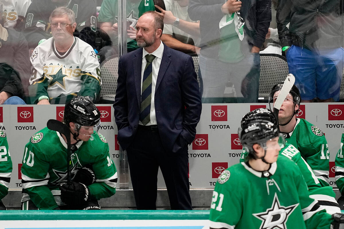 Dallas Stars head coach Peter DeBoer, center, watches play in the second overtime of Game 1 of ...