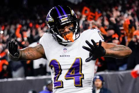 Baltimore Ravens cornerback Marcus Peters (24) reacts after breaking up a pass during a wild-ca ...