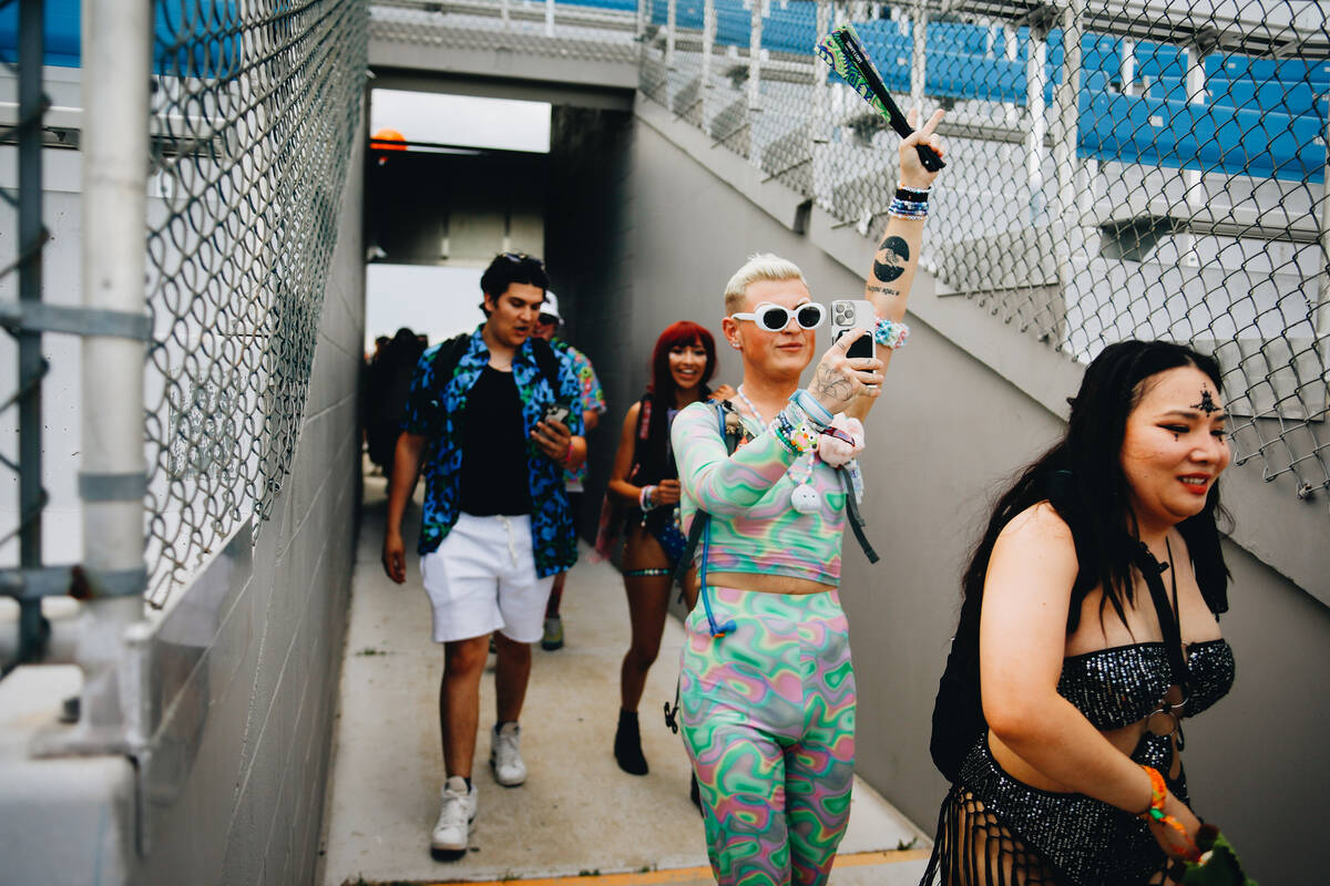 Attendees make their way into the festival during the first day of Electric Daisy Carnival at L ...