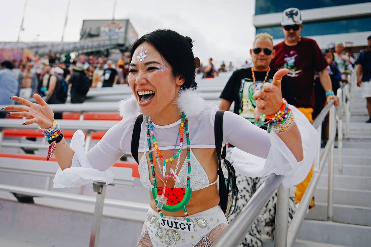 A festival goer dances her way into festival grounds during the first day of Electric Daisy Car ...
