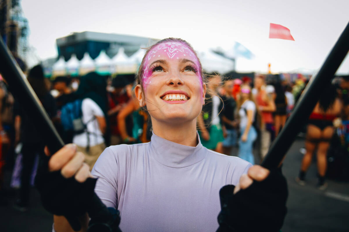 Julie Pielmeier waves a butterfly kite in the air as part of a festival performance during the ...