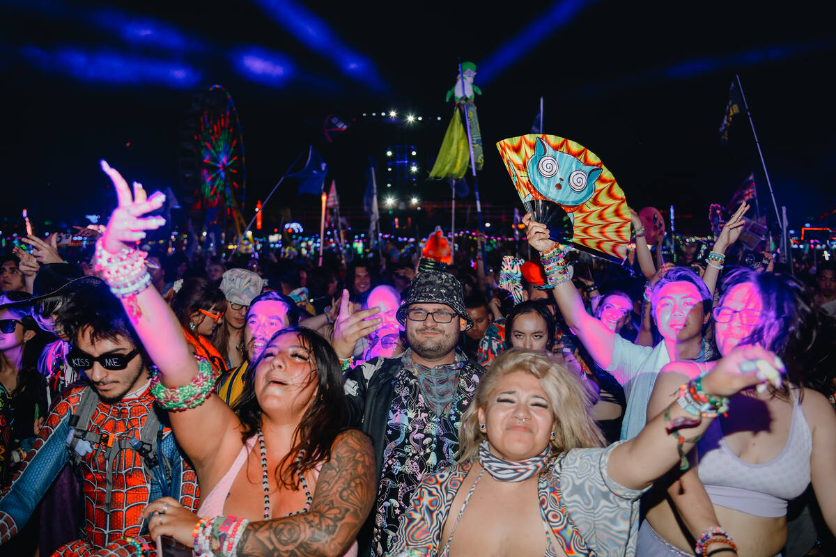 Festival attendees dance to a set at the bassPOD stage during the first day of Electric Daisy C ...