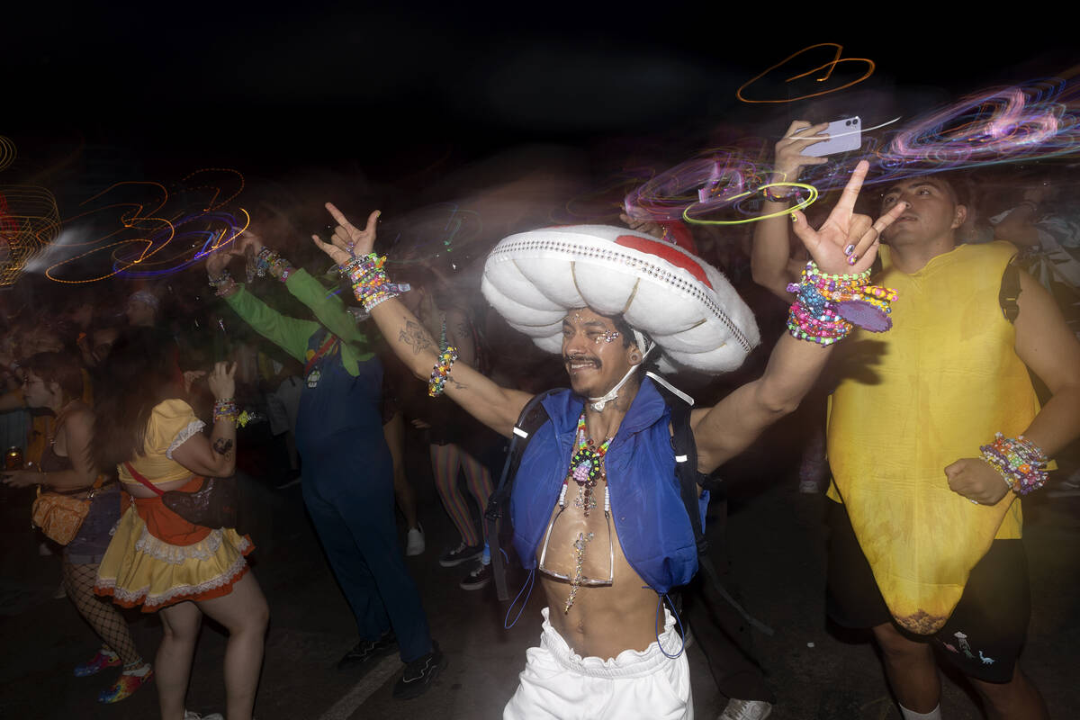 An attendee who identified themself as Mxguelaxgel dances during the second day of electronic d ...