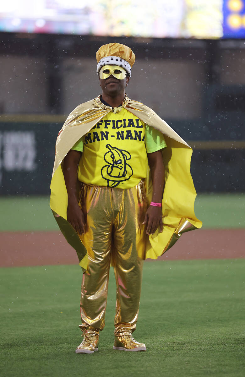 Savannah Bananas’ Man-Nana Bruce stands on the field in a light rain during the Banana B ...