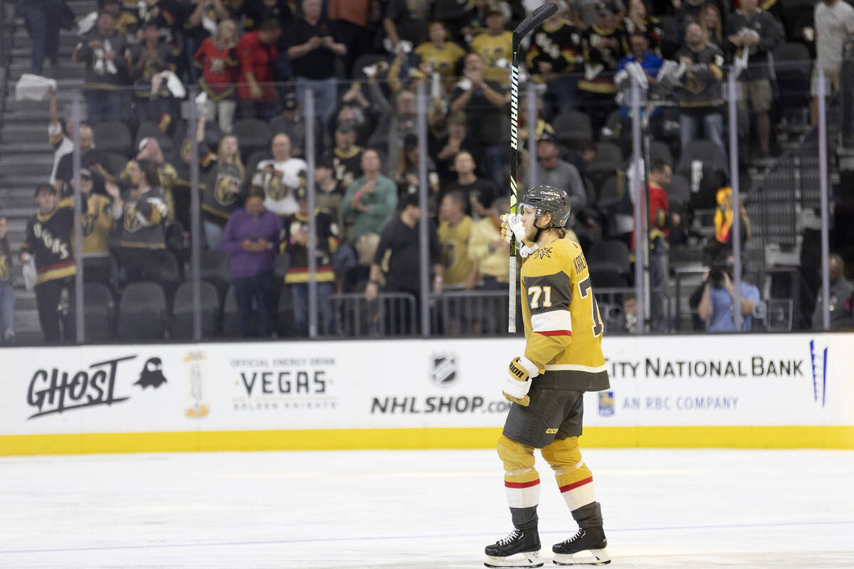 Golden Knights center William Karlsson (71) holds his stick in the air after his team won in ov ...