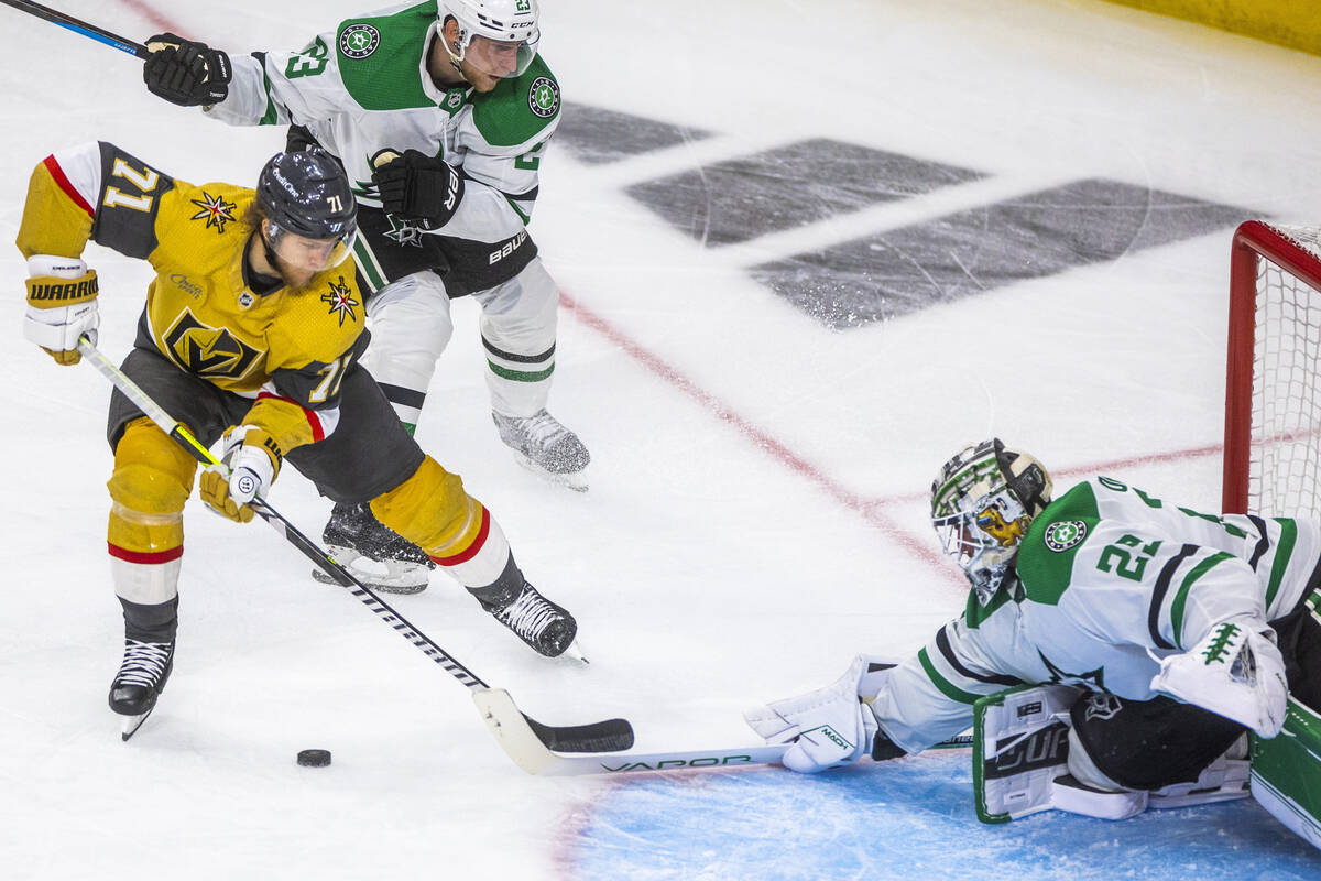 Golden Knights center William Karlsson (71) eyes the goal as he is defended by Dallas Stars goa ...