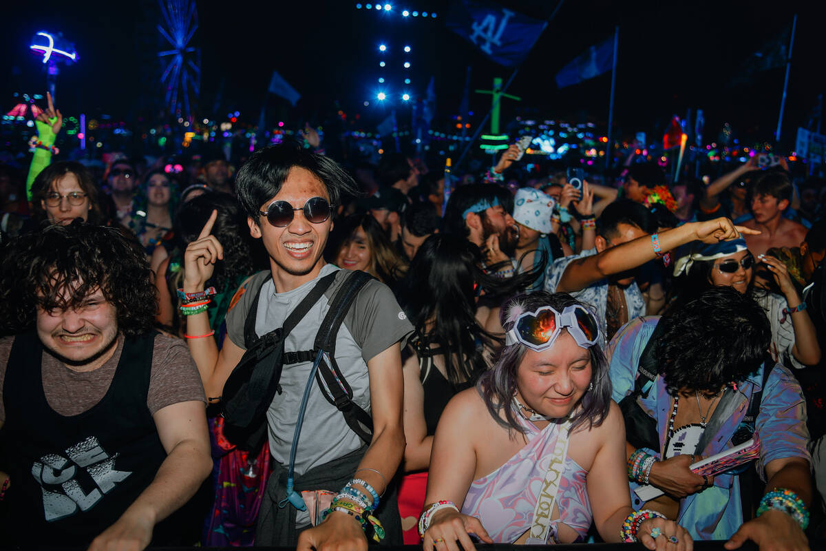 Festival attendees dance to a set at the bassPOD stage during the first day of Electric Daisy C ...