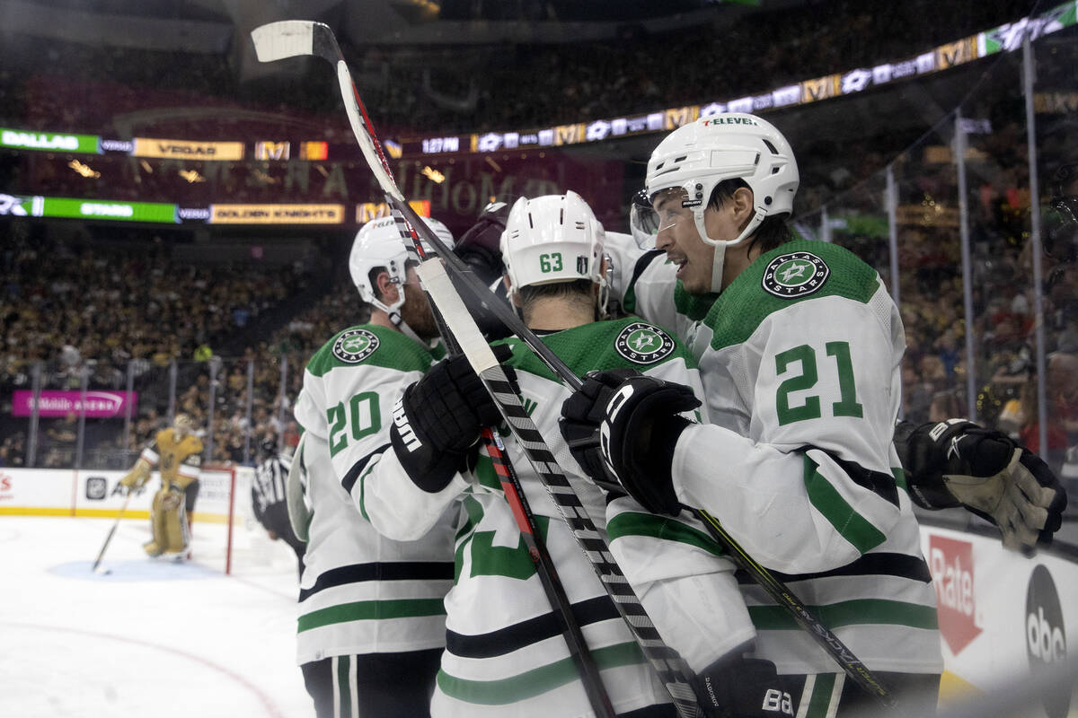 The Dallas Stars celebrate after left wing Jason Robertson (21) scored during the second period ...