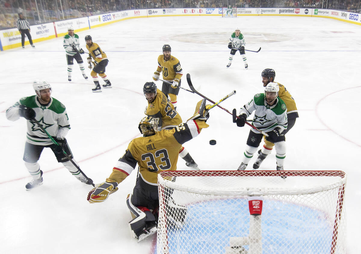 Golden Knights goaltender Adin Hill (33) can’t make the save on a shot by Dallas Stars d ...